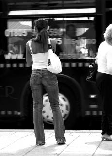Young woman at bus stop