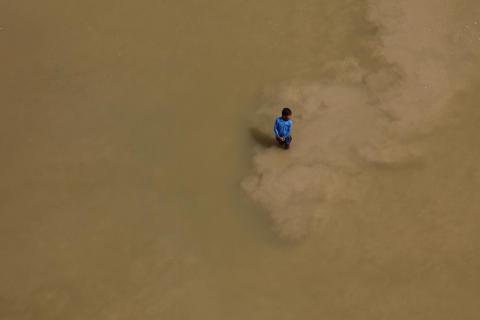 A boy in the river ... India