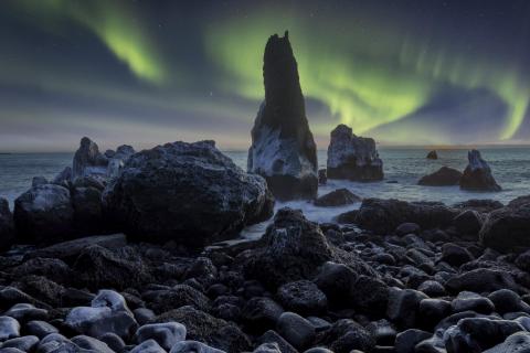 Sea stacks and aurora