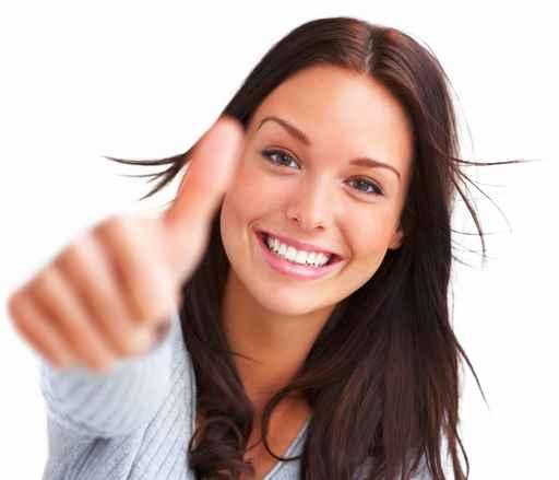 Portrait of attractive young female showing thumbs up