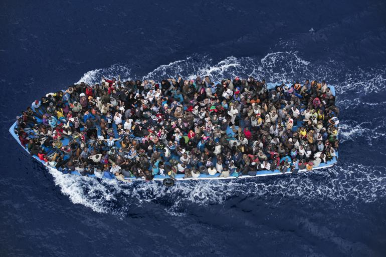7 June, off the coast of Libya: Shipwrecked people are rescued aboard a boat 20 miles north of Libya by a frigate of the Italian navy.